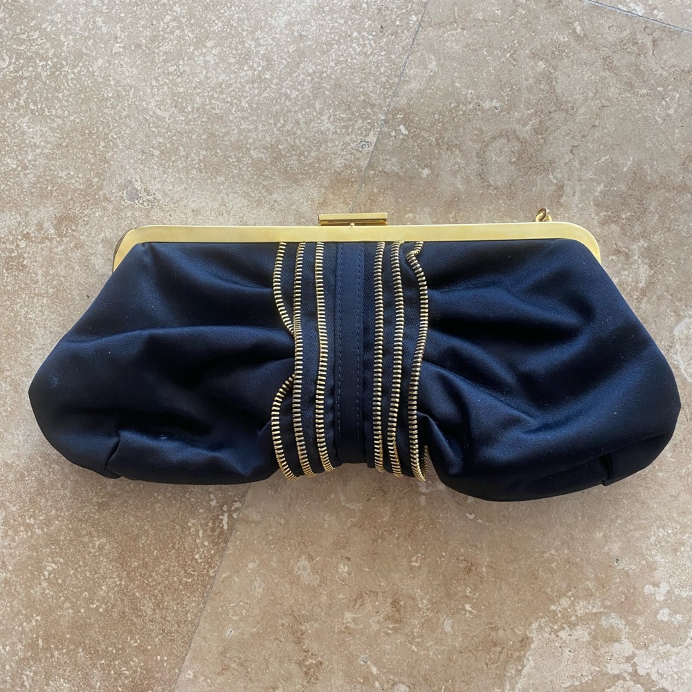 Moschino gold and black clutch